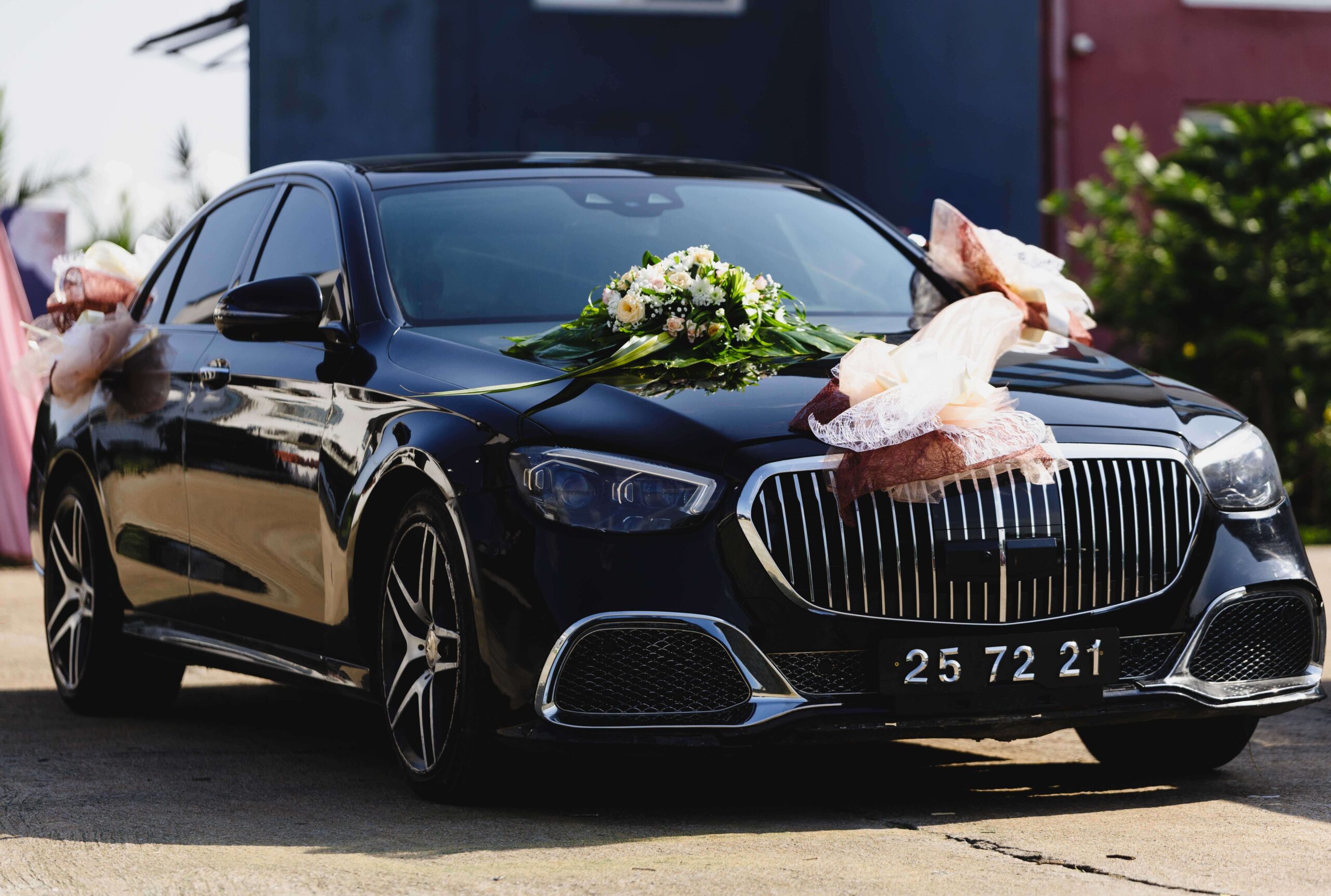 Black Mercedes-Maybach luxury sedan decorated with fresh flowers for a wedding in Los Angeles